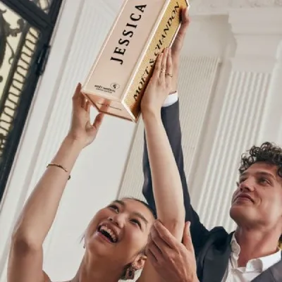 Happy couple with personalized Moët & Chandon “Specially Yours”