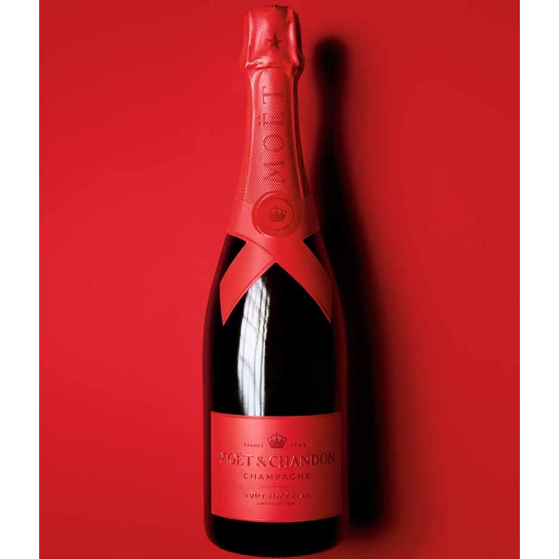 Limited edition Moët & Chandon champagne bottle on red background