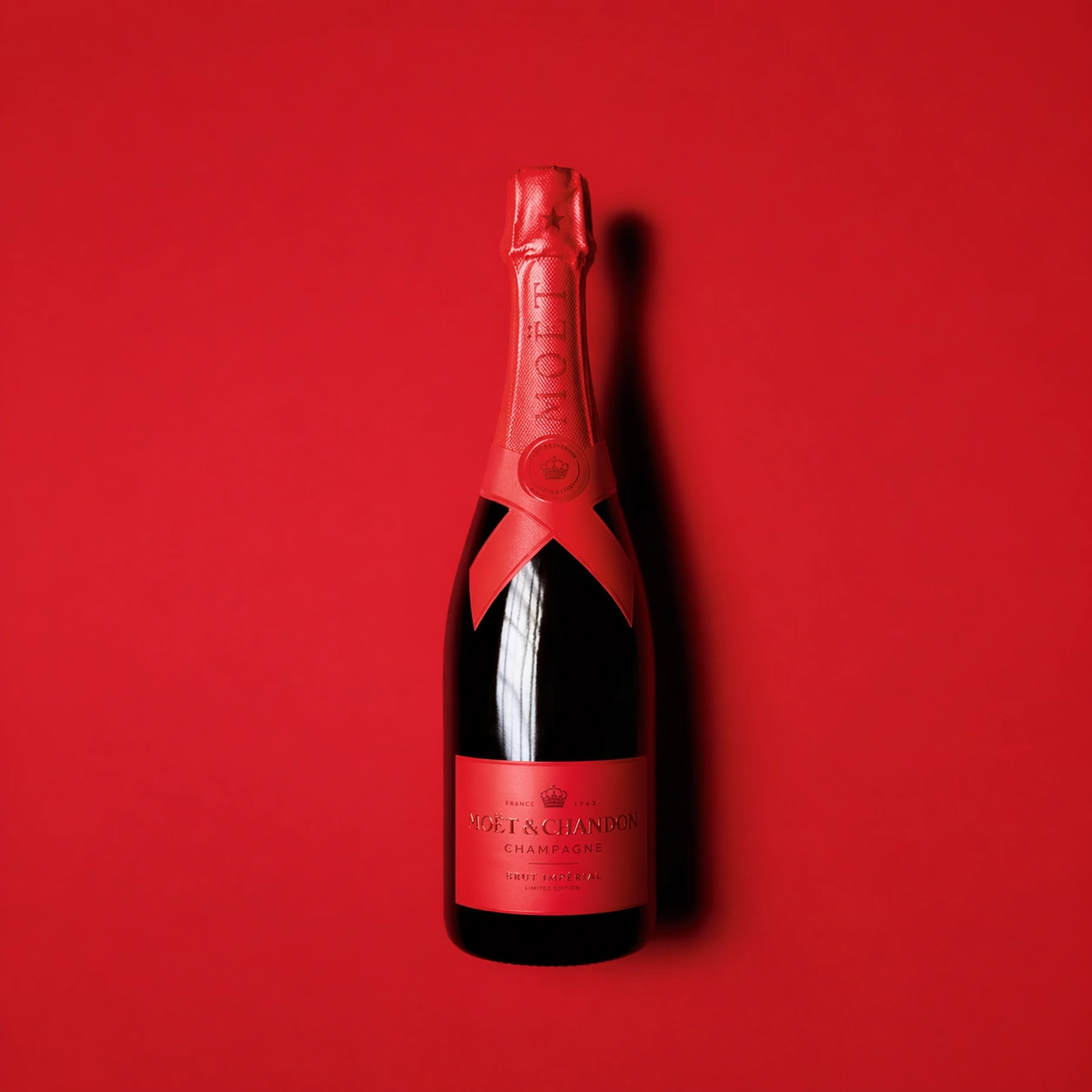 Moët & Chandon Brut Impérial limited edition champagne on red background